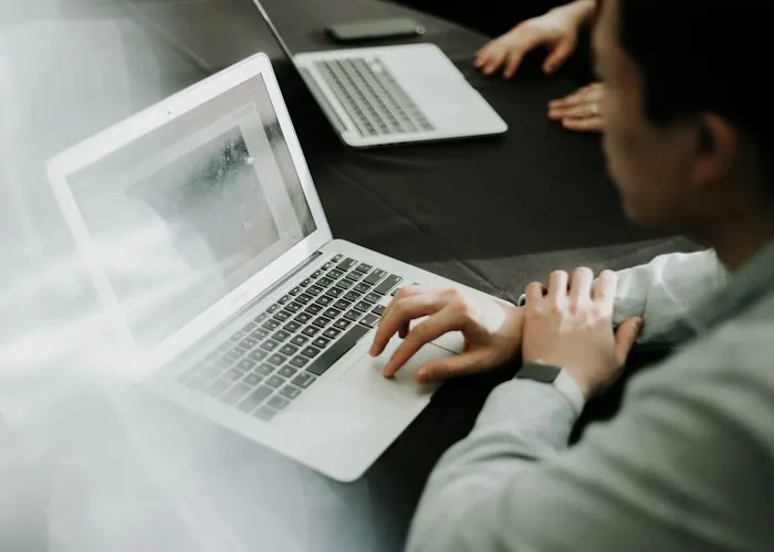 Person analysing results on a laptop